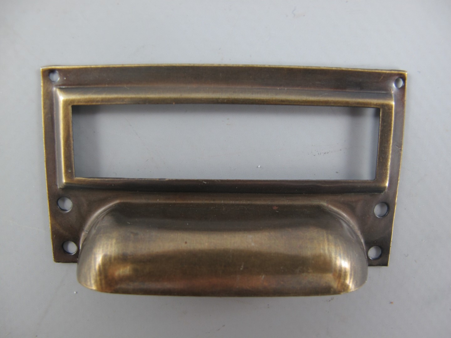 *NT Etiketrahmen/Griff Mess. brün.  L.70x40mm