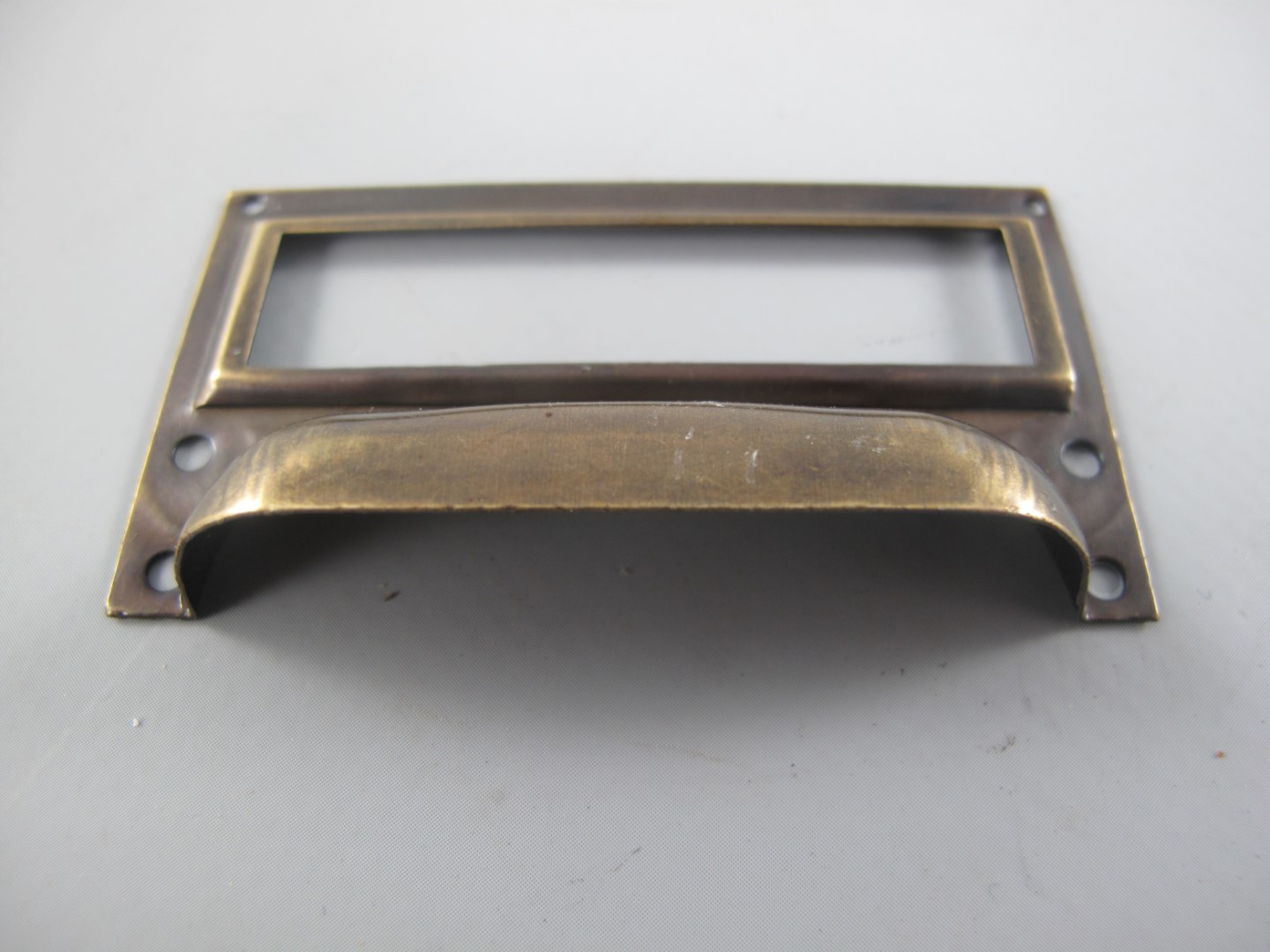 *NT Etiketrahmen/Griff Mess. brün.  L.70x40mm