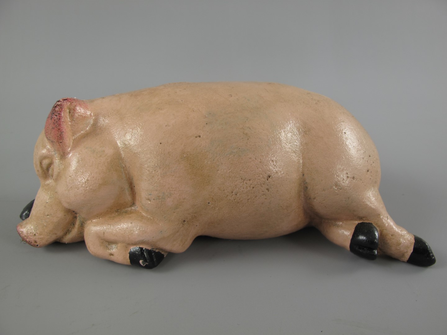 Sparschwein Schläfend Eisen farbig L.18x10cm