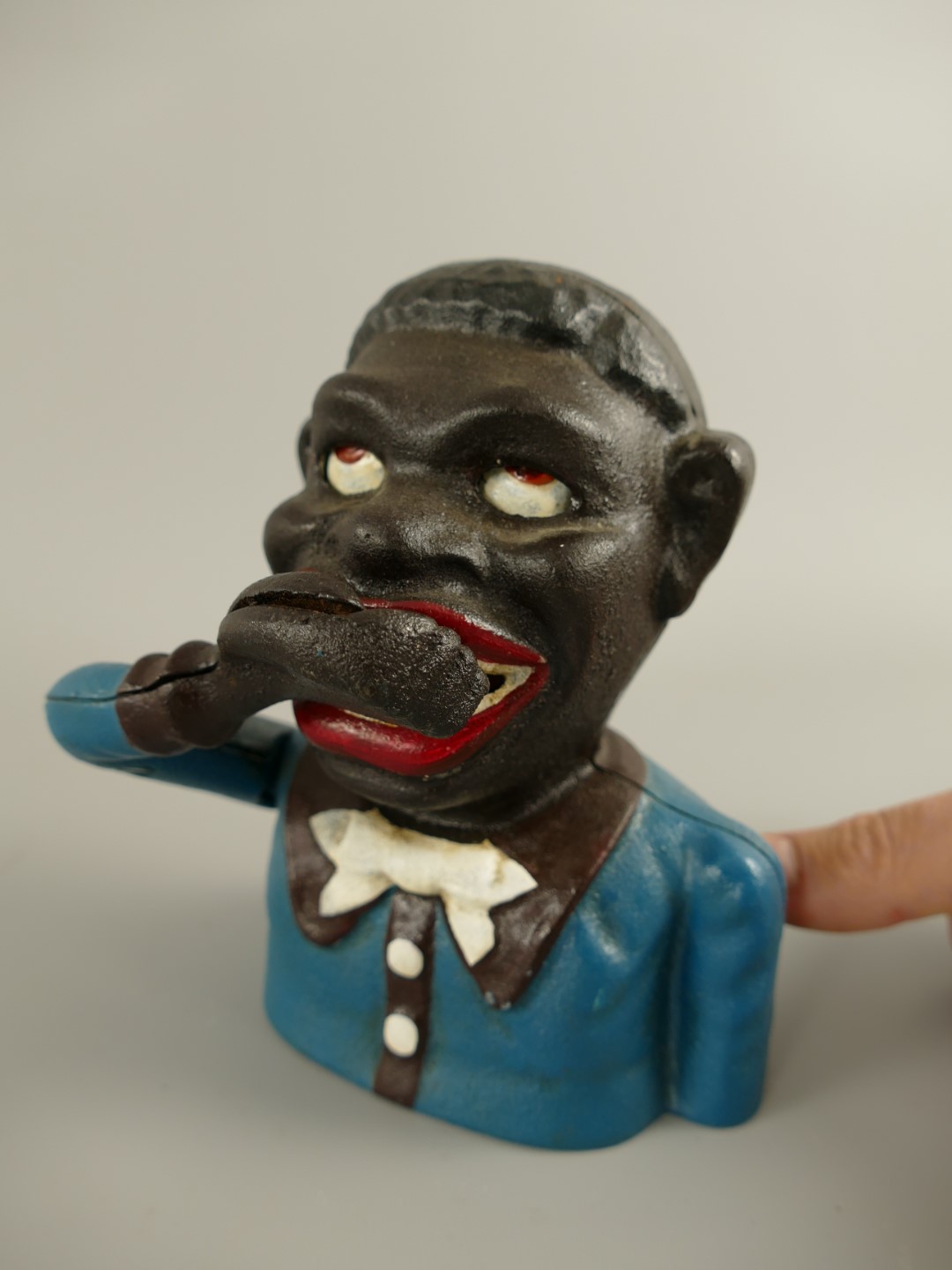 Spardose(Mechan.) Figur(Jolly) H.17x13cm