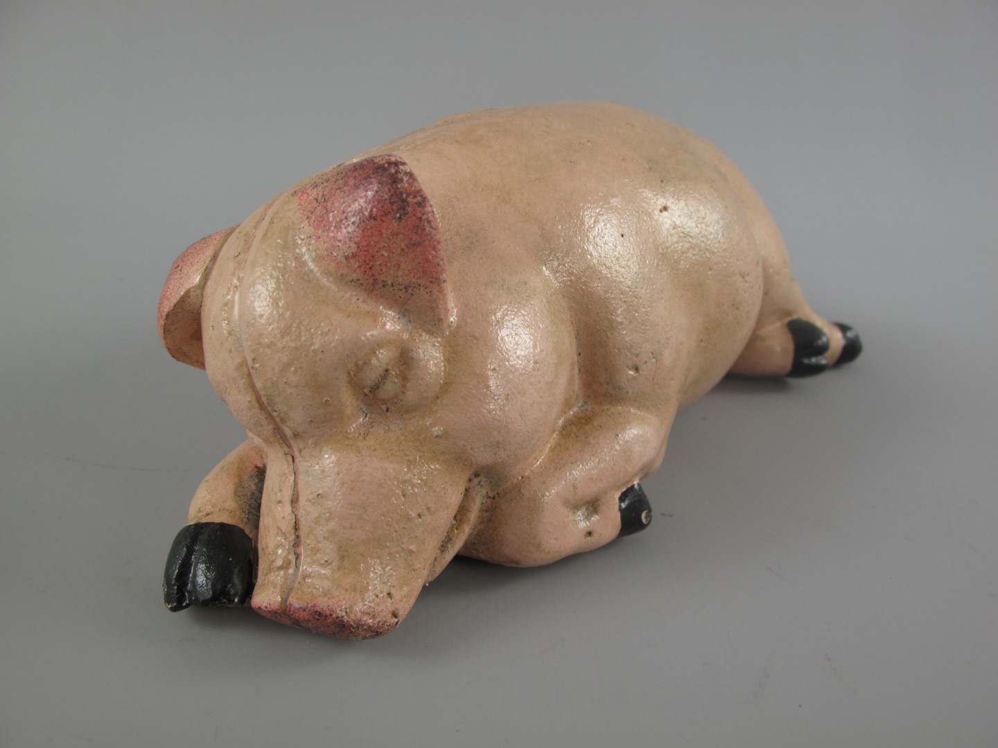 Sparschwein Schläfend Eisen farbig L.18x10cm