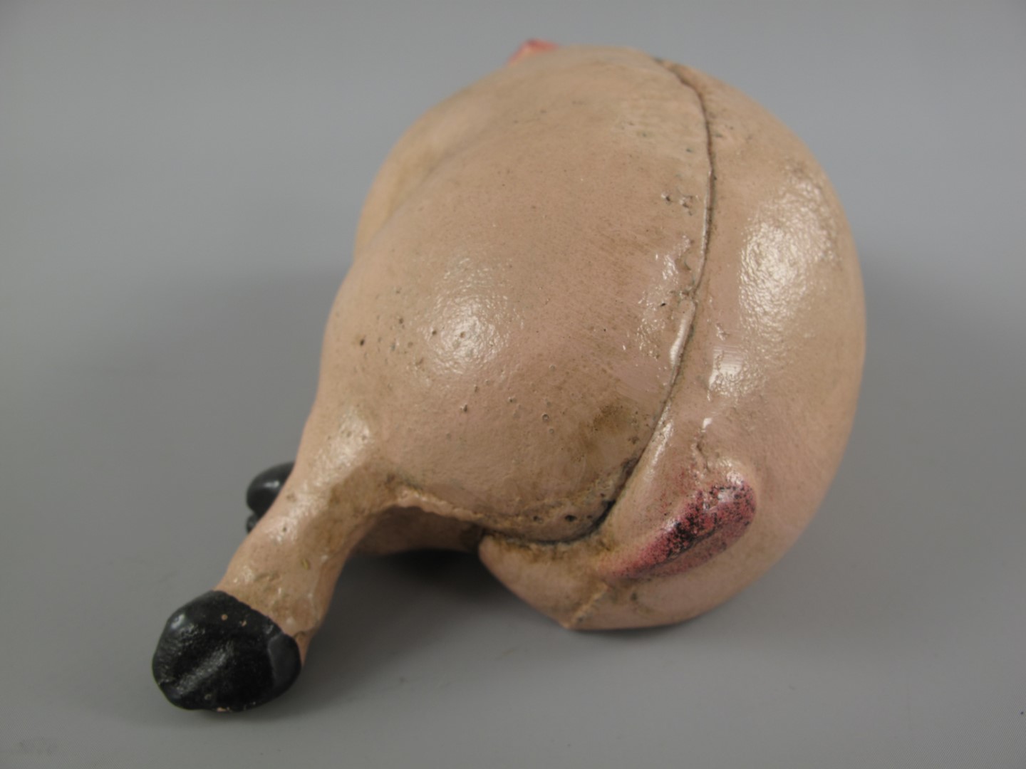 Sparschwein Schläfend Eisen farbig L.18x10cm